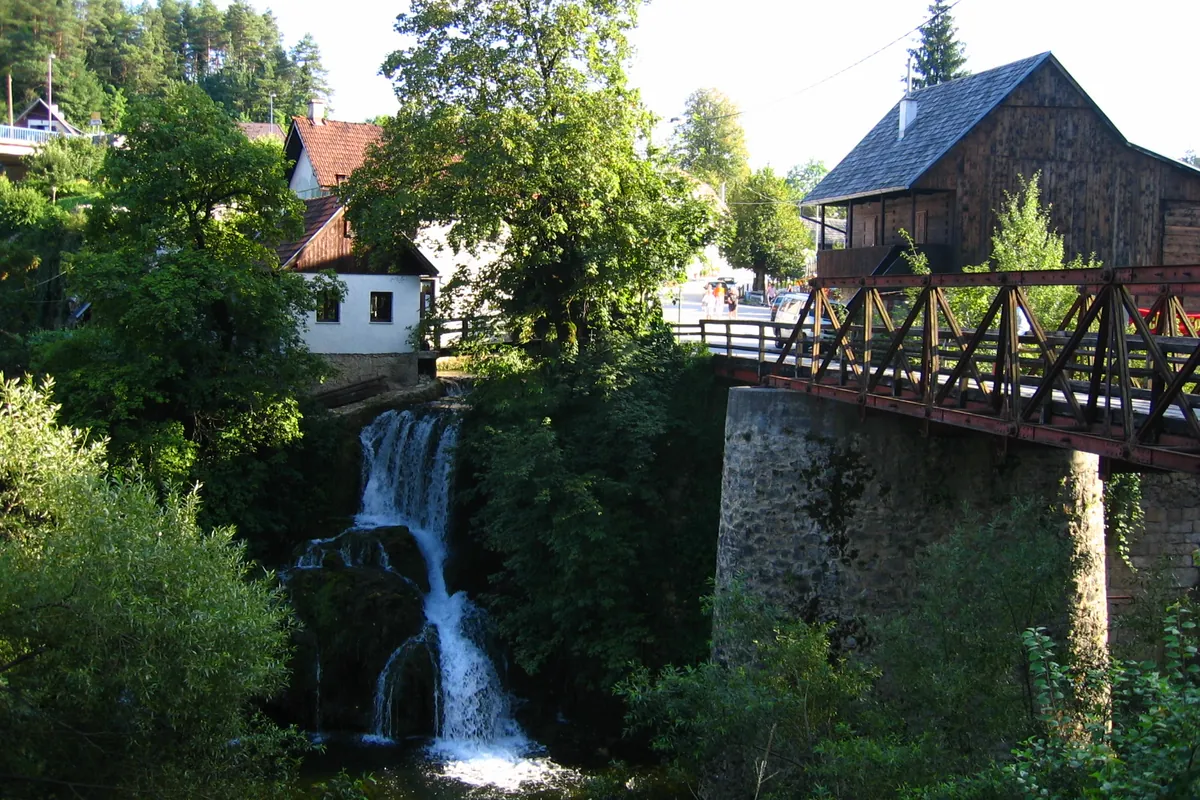 Timber houses and small waterfalls at the Rastoke watermill village in inland Croatia