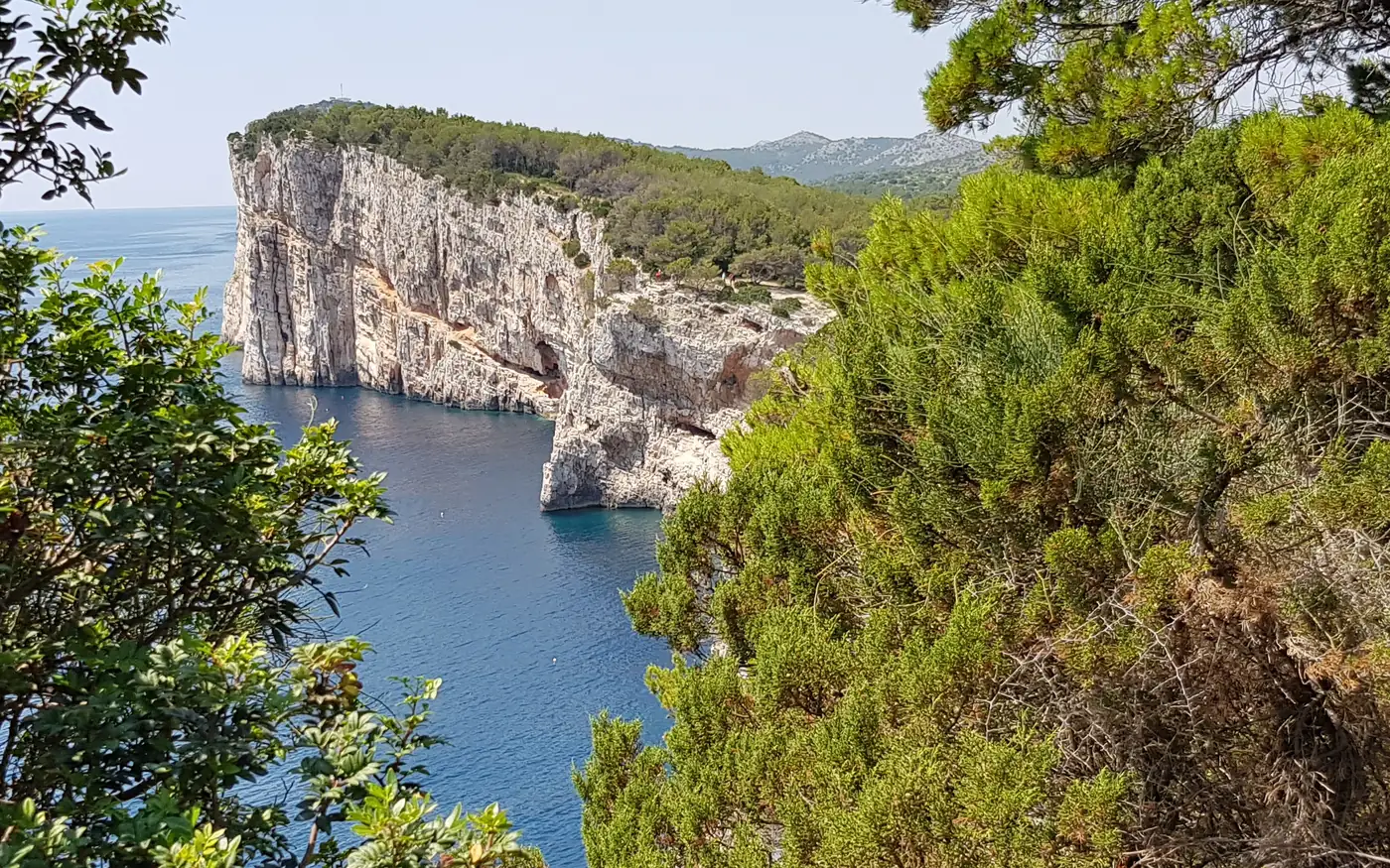 White limestone cliffs of Telascica nature park dropping into the Adriatic on Dugi Otok, Croatia