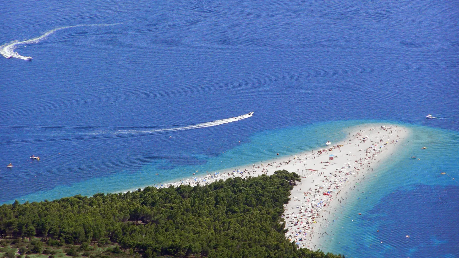 Aerial view of the Zlatni Rat beach, a white horn-shaped cape, at Bol on the island of Brač, Croatia