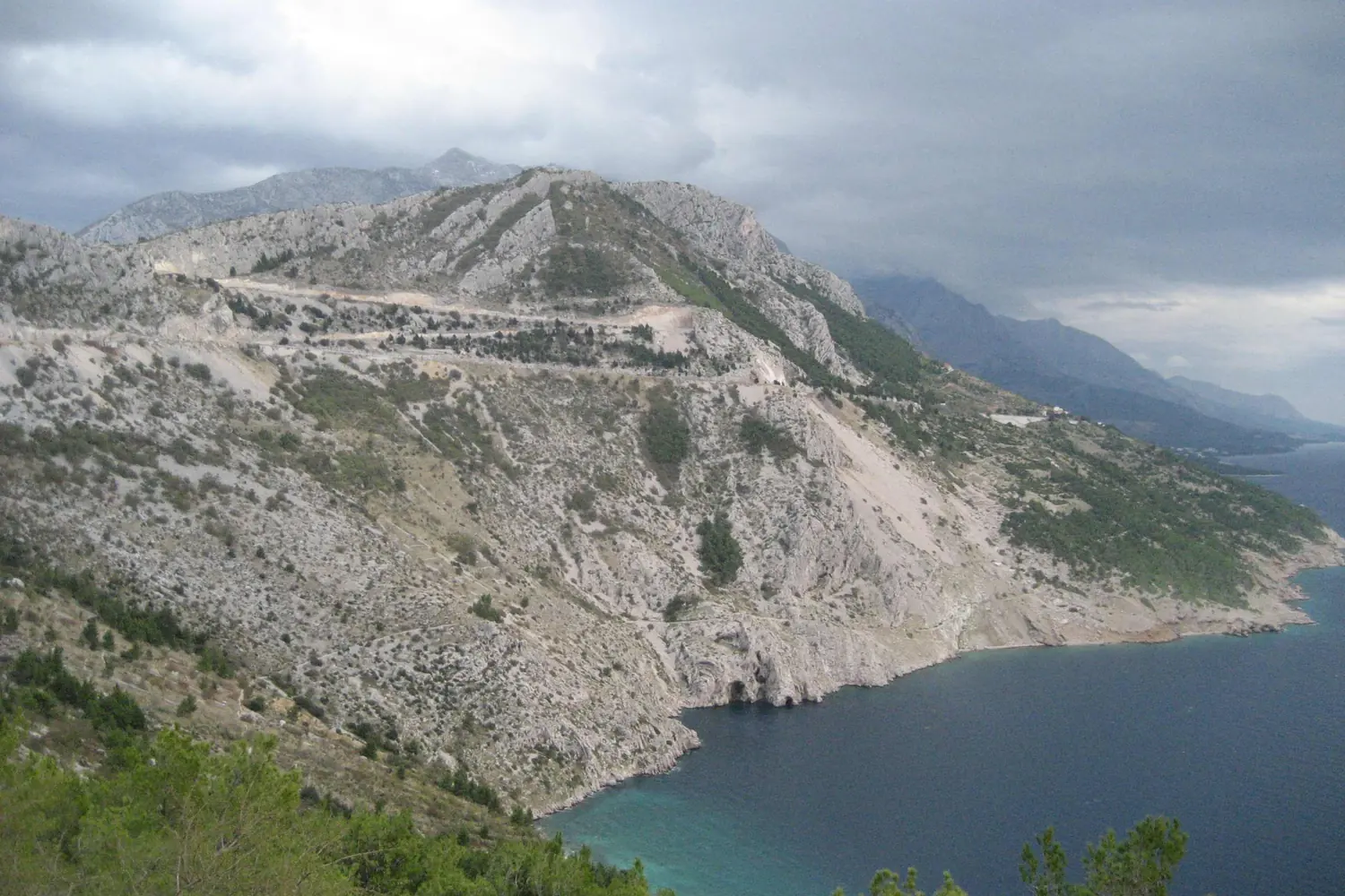 The Jadranska magistrala coastal road winding along the steep karst slope above the Adriatic, Croatia