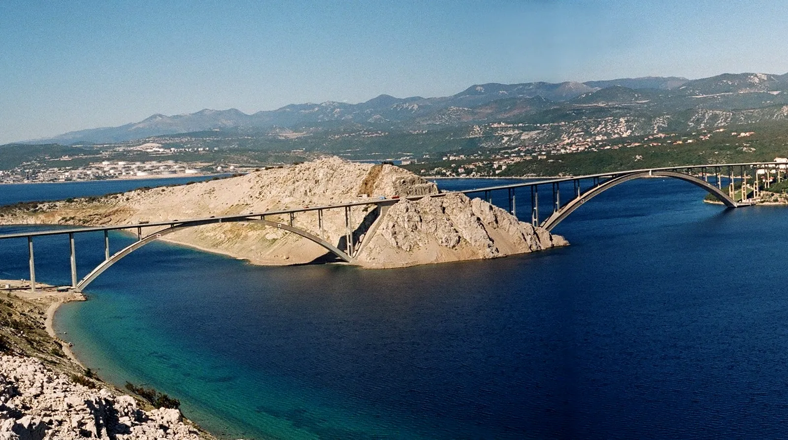 The two arches of the Krk bridge connecting the island of Krk to the Croatian mainland across the Tihi kanal