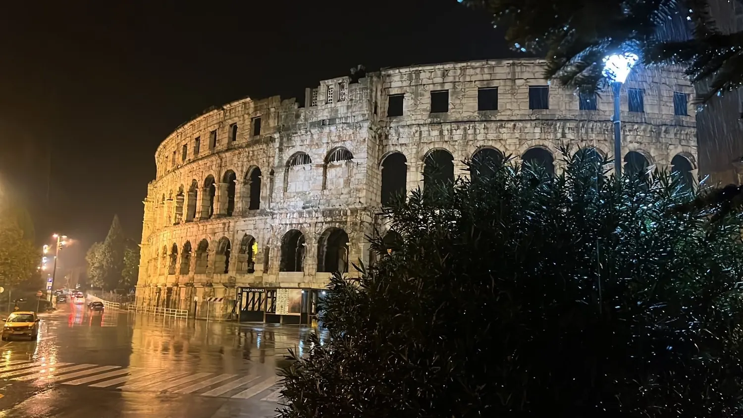 The Roman amphitheatre of Pula lit up in the evening, southern Istria, Croatia