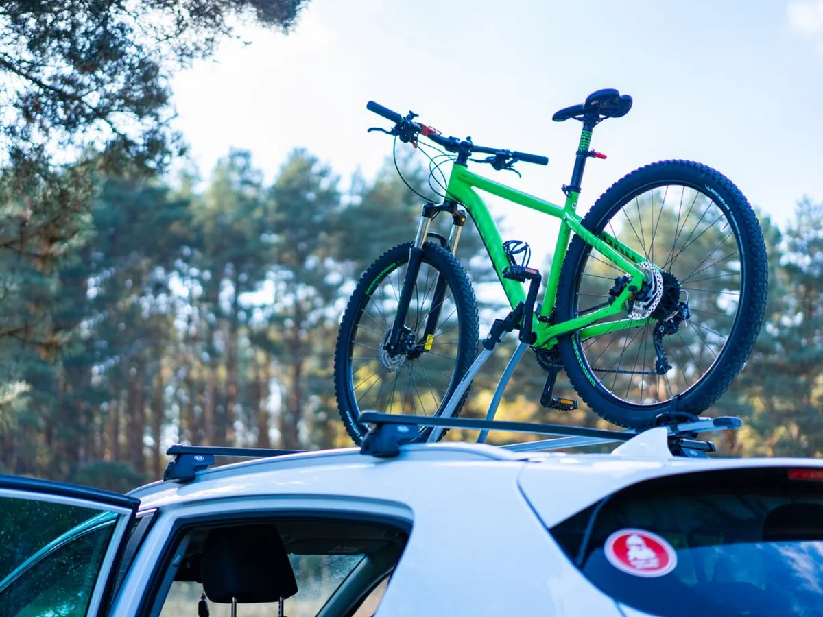 Bicycle mounted on a car roof rack