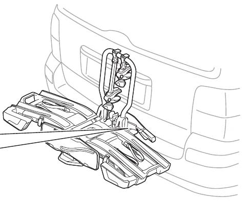 Thule EasyFold XT manual image of the folded carrier mounted on the car towbar